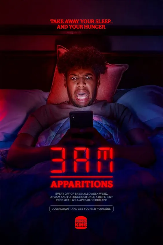 Affiche 3AM Apparitions de Burger King : un homme surpris dans son lit par son téléphone, sous un réveil digital affichant 3AM